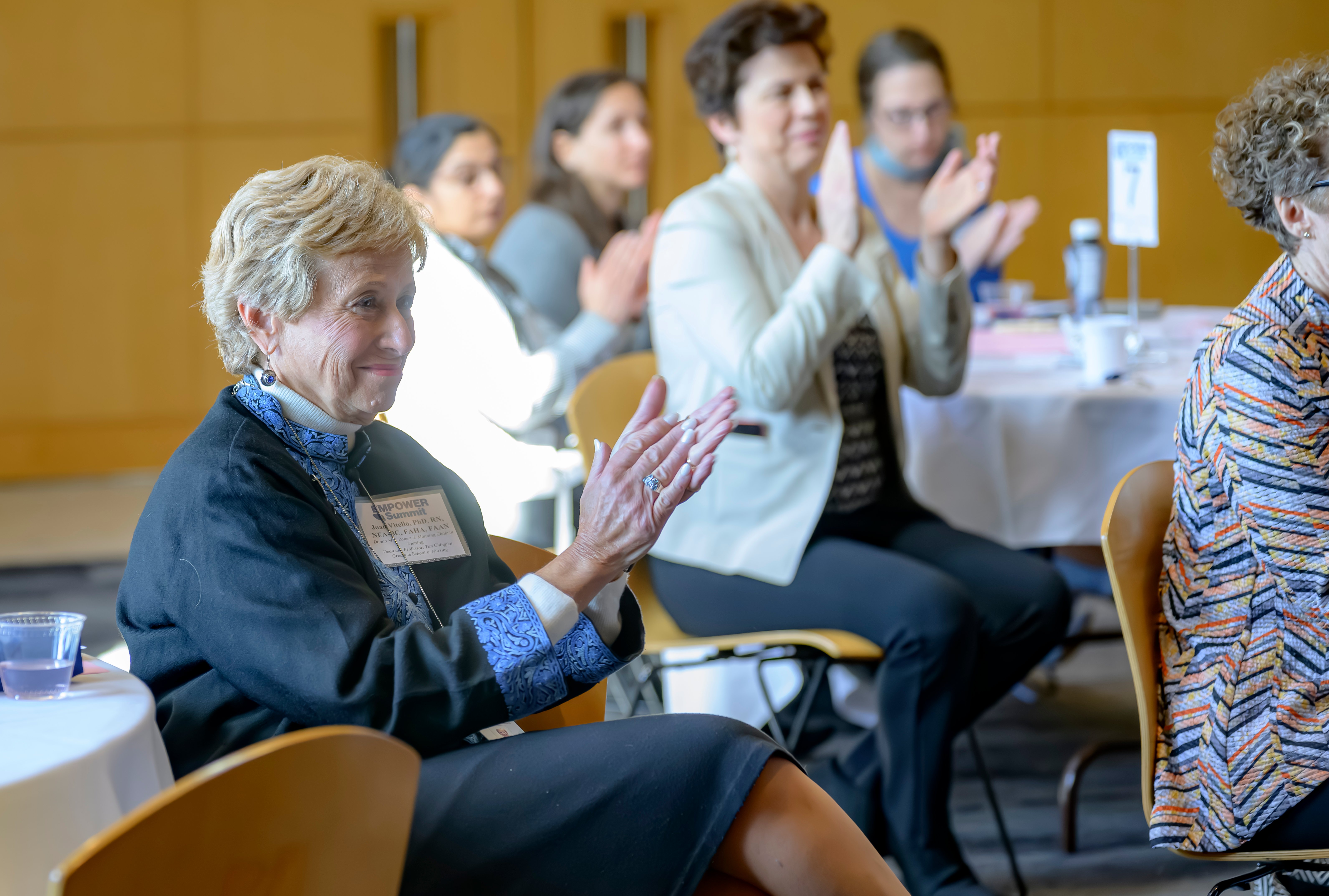 a group of women clapping