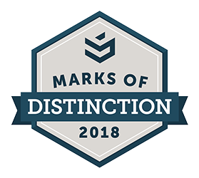 The image shows a gray hexagon with the words Marks of Distinction 2018 inside