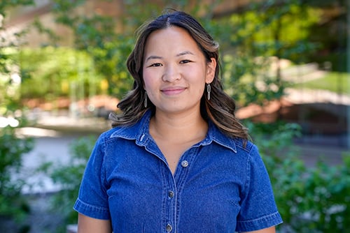 Minhtam Tran standing outside wearing a blue shirt