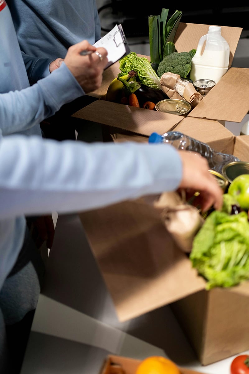 volunteers packing up food