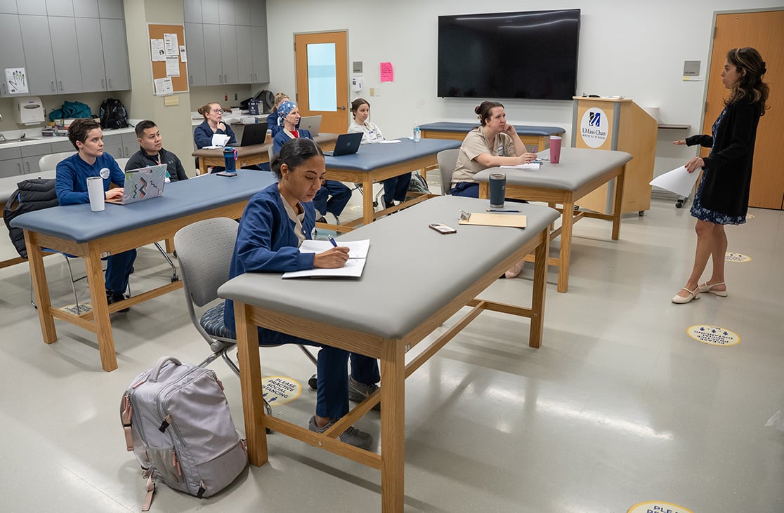  Teacher standing in front of students in a UMass Chan classroom