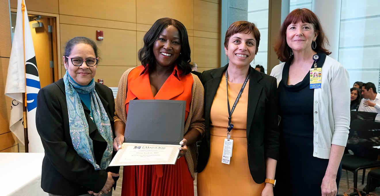 Photo of Abena Yankah, MD, with her Junior Faculty Development Program certificate alongside her mentor, Vandana Nagpal, MD; program director Jennifer Reidy, MD (right); and program co-director Pranoti Mandrekar, PhD (left