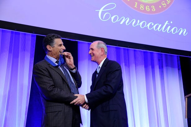 David Clive, MD, recipient of the 2014 Chancellor’s Medal for Distinguished Teaching, shares a light moment with Chancellor Collins.